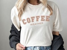 Coffee Weather Comfort Color ShirtCute Coffee Weather Sweatshirt, Winter Sweatshirt, Oversized Fit, Trendy, Cozy Sweatshirts, gift for her  🖤 HOW TO ORDER 🖤 1. Check photos for sizing and color options 📏 2. Select size and shirt from the drop-down menus ✨   3. Add to cart & Place order 🛒 4. Your shirt is now off to production and will be ready for shipment in 5-7 business days. These shirts are MADE TO ORDER! * Comfort colors shirt option: black, pepper, ivory, espresso SIZING * Runs true-to Coffee Crew Neck Top For Loungewear, Trendy Winter T-shirt For Everyday, Casual Coffee Colored Everyday Tops, Cozy Everyday Letter Print Tops, Casual Coffee Colored Top For Everyday, Cozy Everyday Tops With Letter Print, Comfy Everyday Tops With Letter Print, Cozy T-shirt With Letter Print For Loungewear, Cozy Letter Print T-shirt For Loungewear