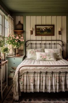 a bed sitting in a bedroom next to a window with flowers on it's headboard