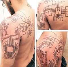 the back of a man's shoulder with circuit board tattoos on it