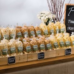 a display in a store filled with lots of different types of popcorn and marshmallows