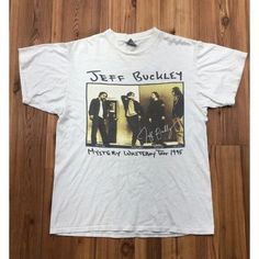 a white t - shirt with an image of jeff buckley and his band