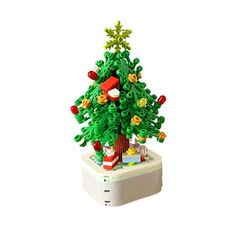 a lego christmas tree on top of a white box