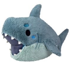 a stuffed shark with it's mouth open