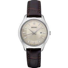 Dress up any casual or business attire with this sophisticated women's watch from Seiko's Essential collection. Dress up any casual or business attire with this sophisticated women's watch from Seiko's Essential collection. DISPLAY Sunray dial Day & date window Luminescence: hands & hour markers Face cover material: Hardlex crystalCASE Material: stainless steel Waterproof screw-down caseback & crown Diameter: 30 mmBAND Band type: brown leather strap Clasp: buckle Circumference: 140 m Elegant Leather Chronograph Watch Accessories, Timeless Round Dial Watch For Workwear, Classic Automatic Watches For Office, Classic Automatic Office Watch, Classic Chronograph Watch For Work, Classic Chronograph Watches For Work, Classic Leather Strap Watch For Office, Classic Automatic Watch For Work, Classic Automatic Watches For Work