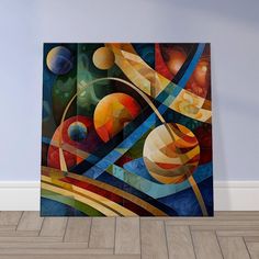 an abstract painting on the wall in a room with hardwood flooring and blue walls