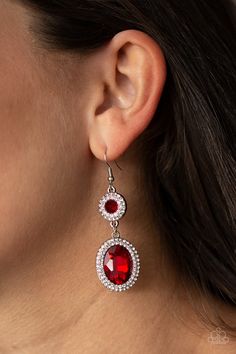 Encrusted in rings of glittery white rhinestones, two fiery red gems connect into a glamorous lure as they elegantly trickle from the ear. Earring attaches to a standard fishhook fitting. Sold as one pair of earrings. P5RE-RDXX-102XX Red Rhinestone Earrings, Red Gems, Paparazzi Accessories Jewelry, Fish Hook Earrings, Fiery Red, Paparazzi Accessories, Red Earrings, White Rhinestone, Red Rhinestone