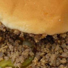 a close up of a hamburger on a plate