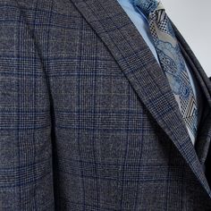 Men's suits are the ultimate in formal wear, designed to make a statement of sophistication and style. Whether you prefer a classic or slim fit, a tailored or bespoke suit, there's a perfect suit for every occasion. With single-breasted or double-breasted styles, notch or peak lapels, and solid colors or checkered and herringbone patterns, you can create a suit that's uniquely yours. For the most formal occasions, a tuxedo or dinner jacket will make you stand out from the crowd. And for a three- Semi-formal Notch Lapel Tweed Jacket, Dapper Semi-formal Tweed Jacket With Notch Lapel, Semi-formal Dapper Tweed Jacket With Notch Lapel, Tailored Tweed Jacket For Business, Tailored Tweed Jacket For Semi-formal Occasions, Tailored Wool Suits In Dapper Style, Fitted Suit With Pocket Square, Fitted Suits With Pocket Square, Semi-formal Dapper Suits