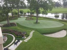 a golf course surrounded by lush green grass