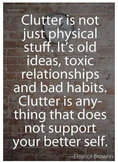 a brick wall with the words clutter is not just physical stuff