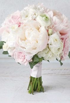 a bridal bouquet with pink and white flowers