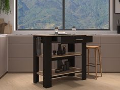 a kitchen island with two stools in front of a large window overlooking the mountains