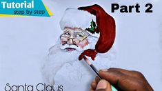 someone is drawing santa claus on a piece of paper