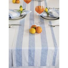 an image of a table setting with lemons and oranges