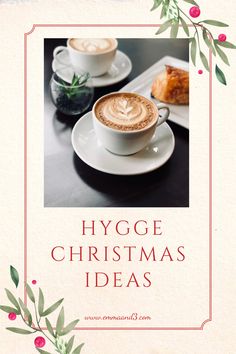 two cups of cappuccino on a table with holly garland around it and the words hygge christmas ideas