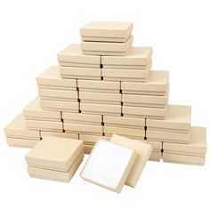 a stack of white boxes and a square box