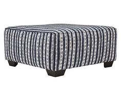 a blue and white striped ottoman with black legs