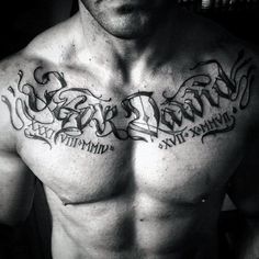 a shirtless man with some writing on his chest and arm tattooing the word love is in cursive letters