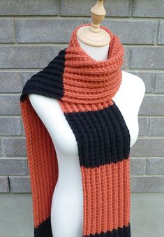 This beautiful hand knitted scarf is made with high quality soft wool blend yarn (80 Alpaca Wool, 20% Nylon). Classic ribbed pattern, it looks the same on both sides. The scarf can be worn in multiple ways. Very beautiful colors. It is hard to show them in a picture. The colors may appear slightly different on different monitors. Measures: 71" (180 cm) long x 7" (17-18 cm) wide. From a smoke-free home. Care instructions: Hand wash in cool water and dry flat. Halloween Scarf, Scarf Wool, Hand Knit Scarf, Black Scarf, Halloween Fashion, Long Scarf, Alpaca Wool, Soft Wool, Knit Scarf