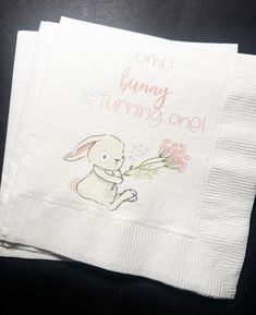 some bunny is turning off napkins on a table