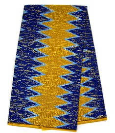 Trendy 100% cotton Kente cloth fabric in gold and royal blue adorned with metallic gold accents, inspired by traditional African designs. Ideal for special occasions, such as African weddings and religious gatherings. Please note that the actual color may appear differently on your monitor. Measurement: Print is 4 yards and Solid is 2 yards. Width is 46 in. Texture: 100% Soft Cotton Care: Hand wash or spot clean. May contain more colors than mentioned above.