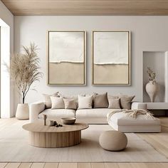 a living room with two paintings on the wall