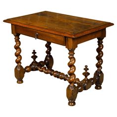 An English Georgian period walnut barley twist side table from the early 19th century with single drawer and H-Form cross stretcher. Crafted in England during the early 19th century, this exquisite Georgian period walnut side table features a rectangular planked top with beveled edges, providing a smooth surface with nice patina. Below the top, a single drawer, adorned with a metal pull, offers practical storage while maintaining the table's clean and classic lines. The base of the table is a tr Walnut Side Table, Walnut Side Tables, English Furniture, Barley Twist, Walnut Table, Practical Storage, Orzo, Beveled Edge, Functional Design