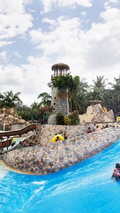 people are playing in the water at an amusement park