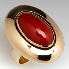 This classy ring is centered with one (1) oval cabochon cut natural coral set into a bezel setting. The ring has a reverse tapered shank. The ring measures 26.3mm X 19.7mm at the top, rises 9.1mm above the finger, tapering to 5.9mm wide and 1.1mm thick at the base of the shank. Signed Carlos Diaz. This ring is currently a size 5.25. Formal Red Domed Rings, Elegant Red Dome Ring For Formal Occasions, Red Oval Cabochon Signet Ring For Formal Occasions, Classic Red Oval Cabochon Signet Ring, Formal Oval Cabochon Ruby Ring With Polished Finish, Luxury Red Oval Signet Ring, Silk Thread Earrings Designs, Classy Ring, Silk Thread Earrings