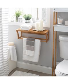 Create more space with the Organize It All wall mounted shelf. Designed to be mounted in your bathroom or sauna, this shelf creates storage and space. The shelf is great for holding towels, toiletries or displaying décor. Completed design with a towel bar for displaying your towels or hanging wet towels to dry. The antimicrobial material makes this shelf long lasting and durable. Made from carbonized bamboo, this is a natural eco-friendly addition to your home. Organize It All Bamboo 1-Tier Wall Slatted Wall, Bathroom Vibes, Shelf With Towel Bar, Wall Mounted Shelf, Hang Clothes, Bamboo Shelf, Bamboo Towels, Entryway Console Table, Laundry Area