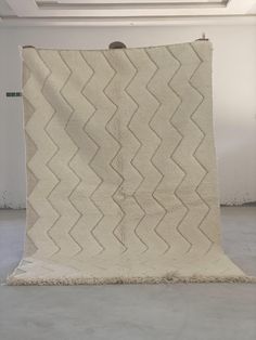 a large white rug with wavy lines on it