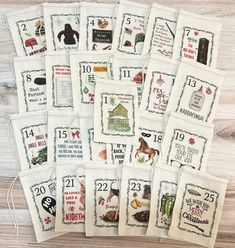 twelve tea towels with different designs and numbers for each individual to use on the table