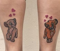 two disney tattoos on both legs, one with the lion and the other with hearts