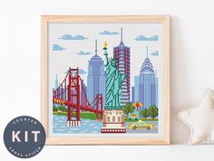 the statue of liberty is shown in this cross - stitch pattern, and it's framed