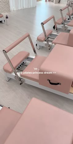 a row of pink chairs sitting next to each other