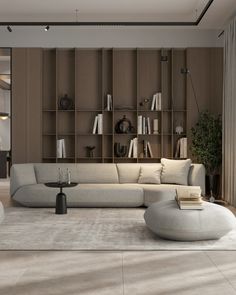 a living room filled with lots of furniture and bookshelves on top of wooden shelves