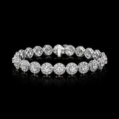 Dazzling Round Diamond Bracelet With 17 Jewels, White Gold Diamond Bracelet With Halo Design, Dazzling Round Platinum Diamond Bracelet, Dazzling Platinum Diamond Bracelet, Round Diamond Bracelet With Halo Design, Diamond Bracelet With Halo Design In White Gold, Diamond Bracelet With Halo Design, Diamond Halo Bracelet, Formal Diamond Bracelet With Halo Design