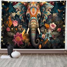 an elephant with flowers on it's head is shown in front of a wall mural