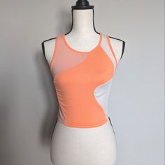 Light And Bright Orange And Orange Abstract Color Block Cropped Ribbed Tank Top Size M Has Great Stretch 95% Polyester 5% Spandex 15.5" Pit To Pit | 16" Long Color Block Workout Tops For Summer, Summer Workout Color Block Tops, Summer Mesh Athleisure Crop Top, Trendy Stretch Mesh Tank Top, Summer Athleisure Mesh Crop Top, Summer Color Block Athleisure Top, Pink Fitted Mesh Top, Color Block Tops For Sports In Summer, Summer Sportswear Color Block Top