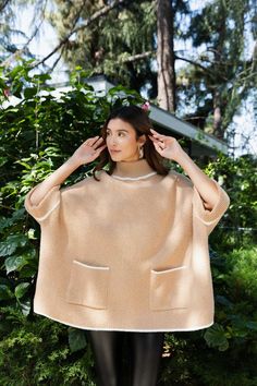 Experience the ultimate blend of warmth and style with our CozyCove Turtle Neck Poncho. This luxurious poncho features a snug turtle neck and easy-to-use arm openings, allowing you to move with ease while staying cozy. Perfect for both casual and chic looks, embrace comfort and fashion in one effortless piece. #lovemyleto 100% Polyester Imported Poncho With Arm Holes, Turtle Neck Poncho, Sorority Rush Dresses, Minimalist Preppy, Casual Bodysuit, Bachelorette Dress, Rush Dresses, Bridal Shower Dress, Jumpsuit Shorts Rompers