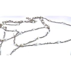 This is part of Chairish’s Fine Jewelry assortment.  A many of you know I just love long chains.  I had this made for me by my bench jeweler last year.  This is a platinum chain and it is studded with Seed Pearls and Diamonds.  There are 53 Seed Pearls and 53 Diamonds interspersed with pearl, Diamond, pearl.  The Pearls are all perfect and sized 3.7mm and the Diamonds are .05 points each.  As for the Diamonds the weight is approximately 2.85 carats the weight is 11.3 grams of Platinum.  I wore this chain with a long Diamond chain together and it does make a statement.  I have been asked to find seed pearl long chains which I have had and sold, so here is a new one with all the bells and whistles. Luxury Multi-strand Pearl Chain Jewelry, Elegant Double Strand Long Necklace For Formal Occasions, Formal Double Strand Long Necklace, Luxury Silver Chain Necklace For Wedding, Elegant Double Strand Beaded Chain Necklace, Elegant Metal Lariat Long Necklace, Luxury Long Silver Chain Necklace, Elegant Metal Long Chain Necklace, Luxury Silver Long Necklace