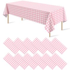 a table covered in pink and white checkered cloths with wooden legs, set against a