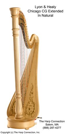 a large golden harp sitting on top of a wooden stand