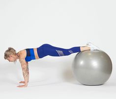 a woman doing push ups on an exercise ball