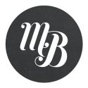 a black and white logo with the letter b in it's center, on top of