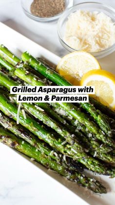 asparagus with lemon and parmesan cheese on the side