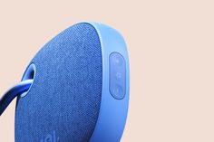 an image of a blue wireless speaker