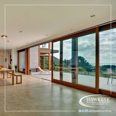 a large open living room with sliding glass doors