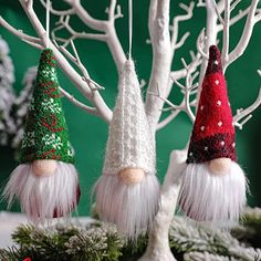 three gnome hats are sitting on top of a tree