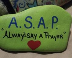 a green rock with the words asap always a prayer written on it and a red heart